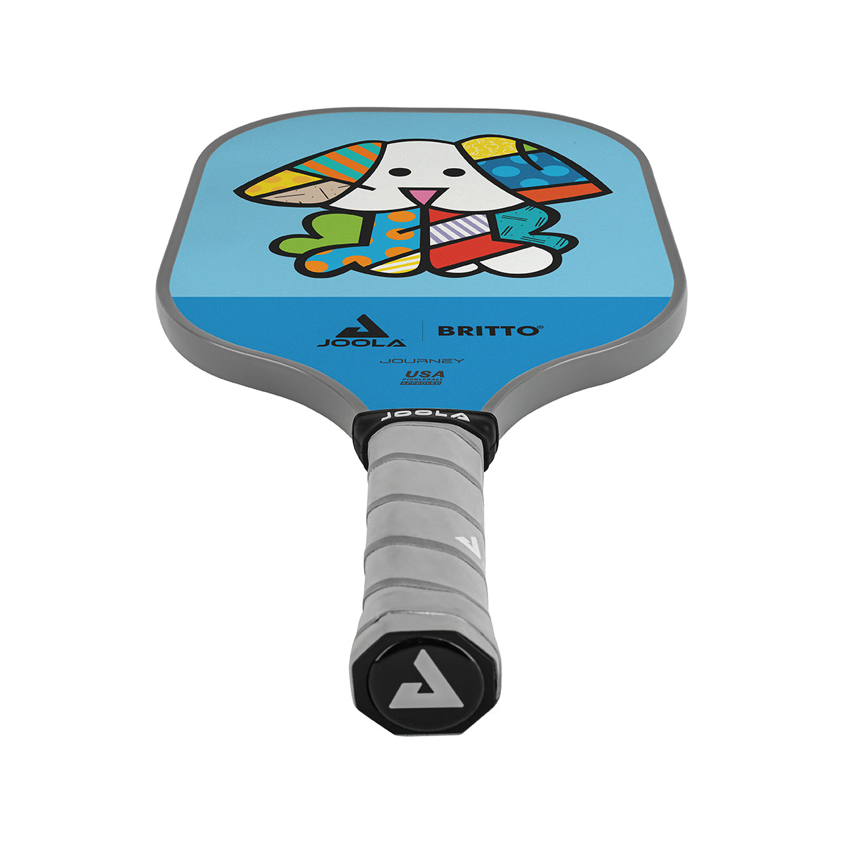 White Background Image: JOOLA x BRITTO paddle, grey handle, blue and light blue paddle face with an image of a dog.