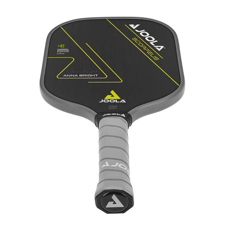 White Background Image: JOOLA Anna Bright Scorpeus CFS 14 with black paddle face, lemon accent font and JOOLA Trinity logo, gray edge guard, gray Feel-Tec Pure Grip