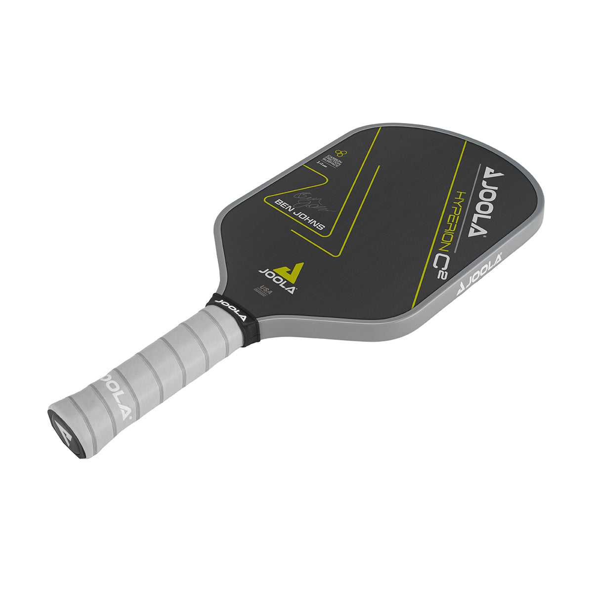 White Background Image: Ben Johns Hyperion C2 Pickleball paddle. Black surface with yellow lines and Ben Johns' signature. Grey handle and grey edge guard with white JOOLA logo.