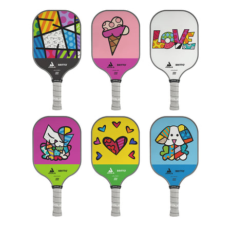 White Background Image: All six versions of the JOOLA x BRITTO pickleball paddles. Top left to right: Britto Landscape, Ice Cream Cone, Love Logo, Cat Image, Heart Image and Dog Image. 