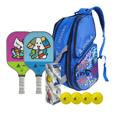 White Background Image: Two JOOLA x Britto Paddles, a pack of four JOOLA Primo Balls and one JOOLA x Britto Blue Tour Elite Bag. One paddle features Britto art of a cat and the other paddle features a dog. Bag is blue with JOOLA logo and Britto art on the side.