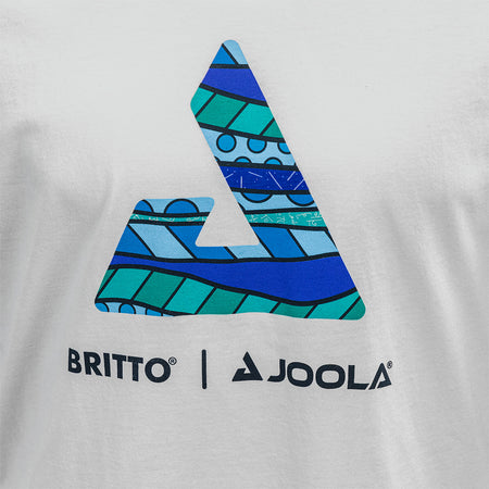 White Background Image: White JOOLA x BRITTO tee shirt. Large JOOLA logo in the middle of the shirt in blue and turquoise BRITTO design. Small BRITTO x JOOLA logo on the back side of the shirt near the neck.