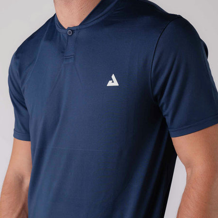 Close up image of the heat sealed JOOLA trinity logo on the JOOLA Men's Court Polo. Navy.