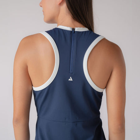 Image of the back of the JOOLA Women's Court Dress, Navy. Image is highlighting the zipper and the JOOLA trinity logo on the back.