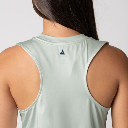 Close up image of the JOOLA Trinity logo between the shoulder blade on the back of the JOOLA Women's Court Tank, Hushed Mint.