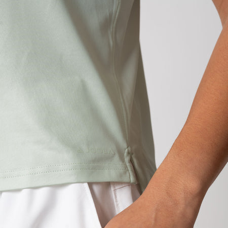 Close up image showing the side hem detail on the JOOLA Women's Court Tank, Hushed Mint.