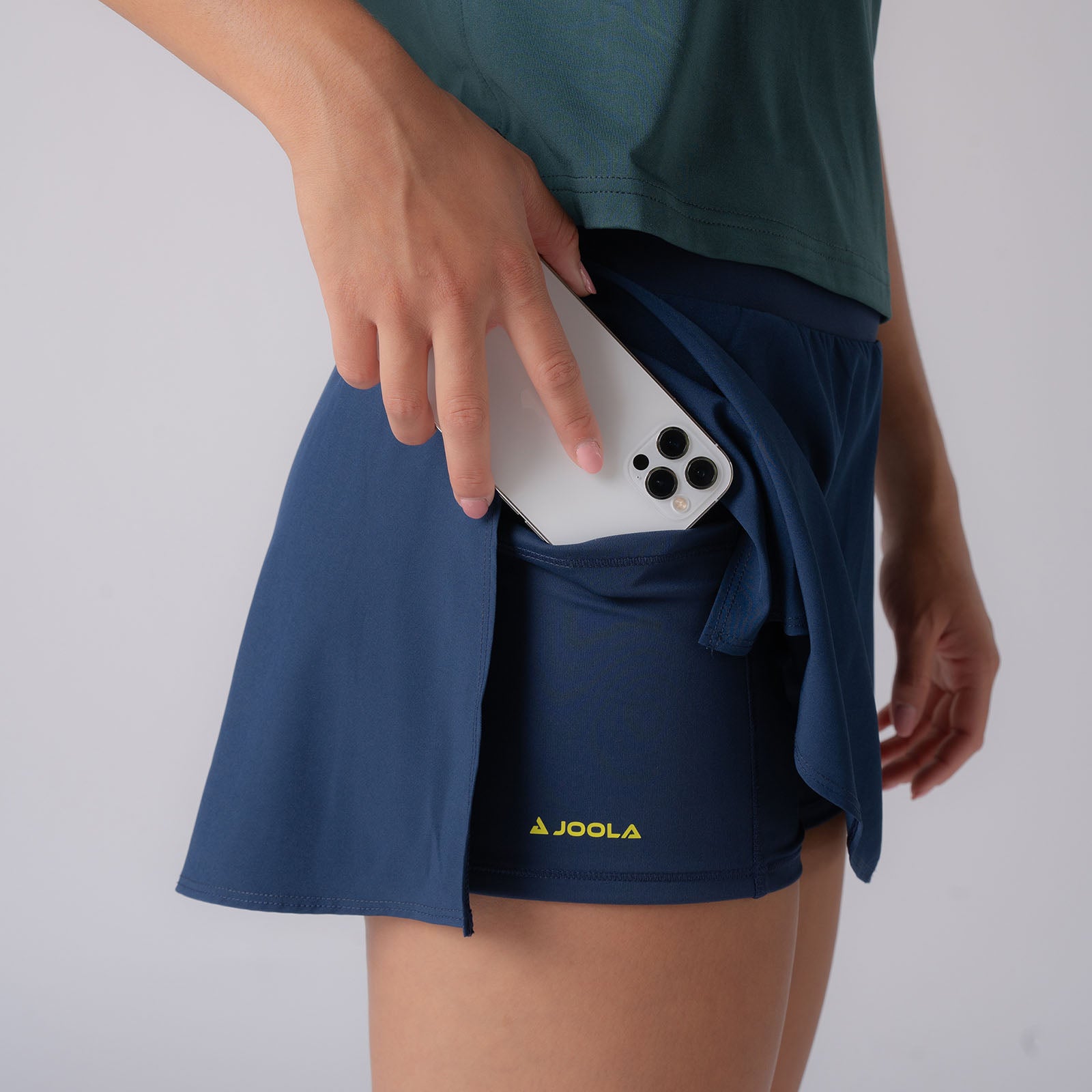 Image showing the hidden under shorty pocket on the JOOLA Women's Pickleball Skort, Navy.