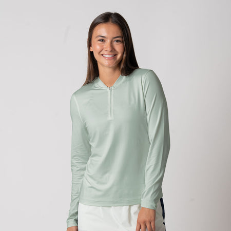 Female model wearing a JOOLA Women's Quarter Zip Pullover, Hushed Mint.