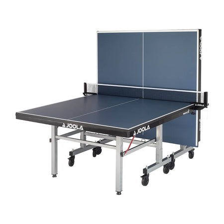 White Background Image: Full view of the World Cup 25 table tennis table, one half of the table is upright at a ninety-degree angle. 